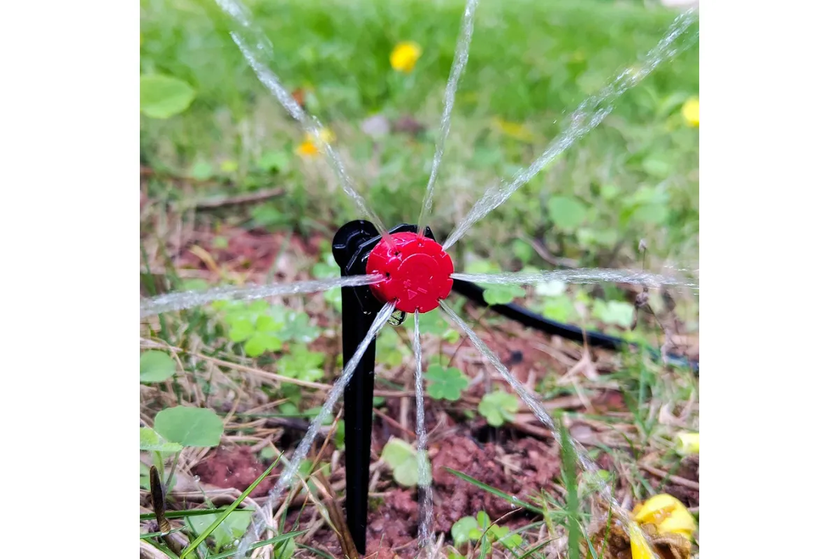 red dripper showering in the home garden